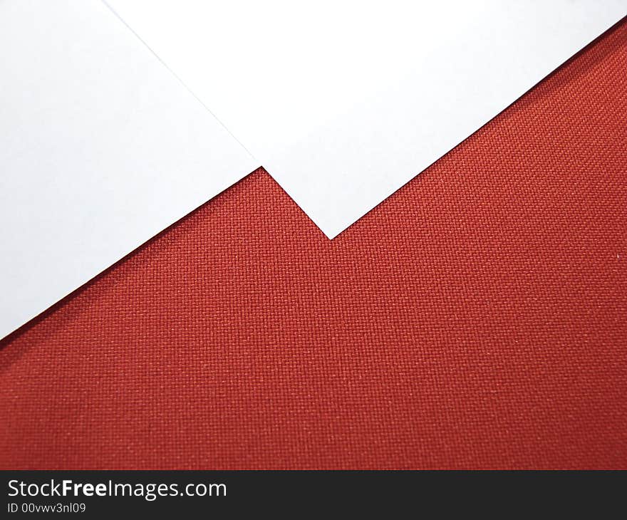 White paper sheets on red