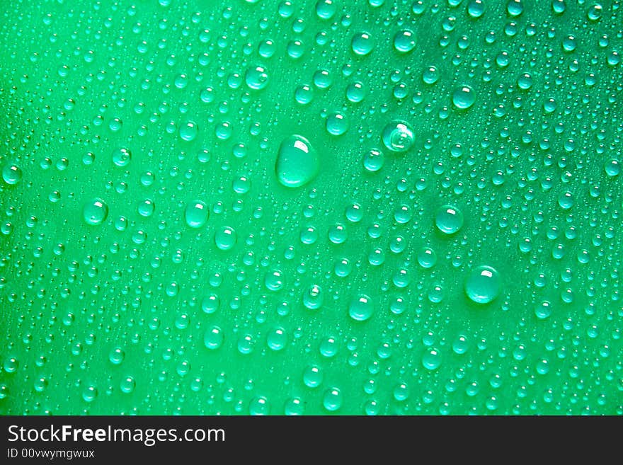 Drops on a green  textured Plastic foil