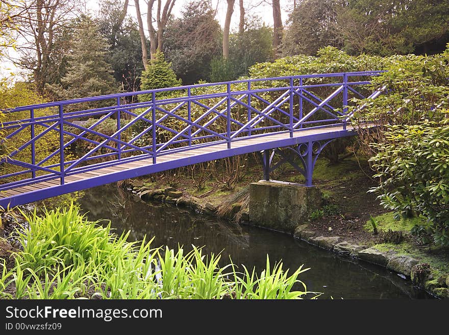 Blue Bridge crossing pond in Spring park