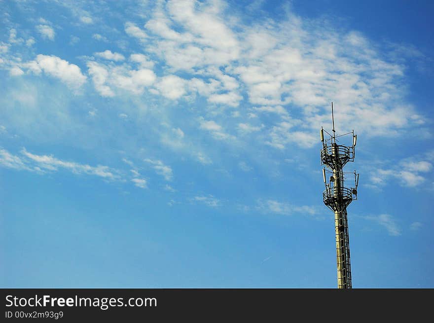 Telecommunication mast on blue sky