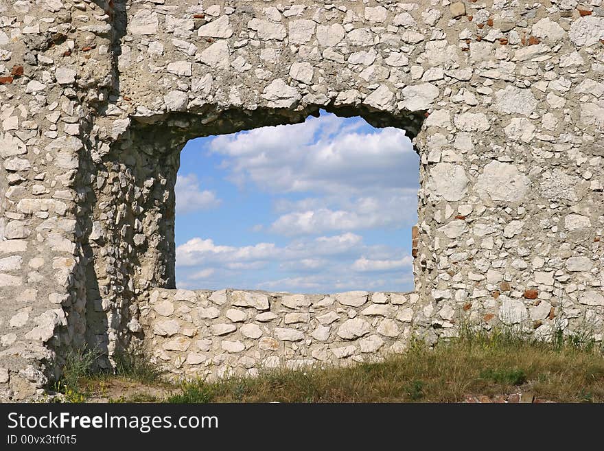 View at sky and clouds through a window of a ruin. View at sky and clouds through a window of a ruin