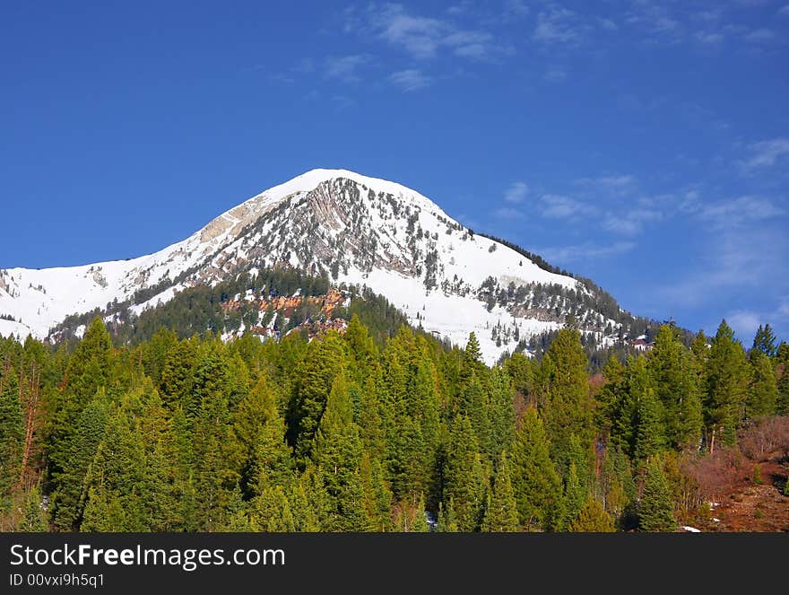 Large mountain with snow on it in the spring. Large mountain with snow on it in the spring