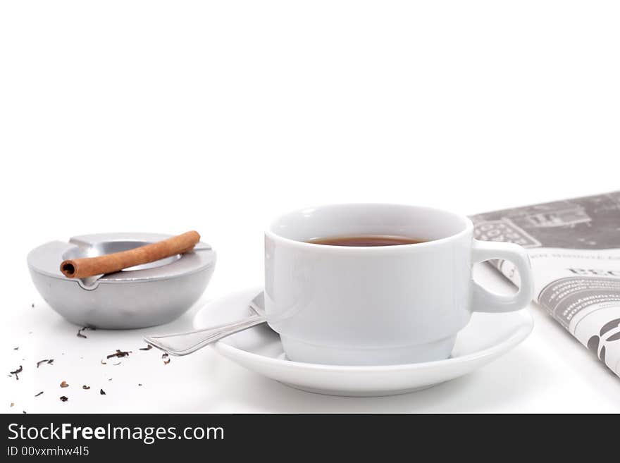 Tea, ashtray and newspaper