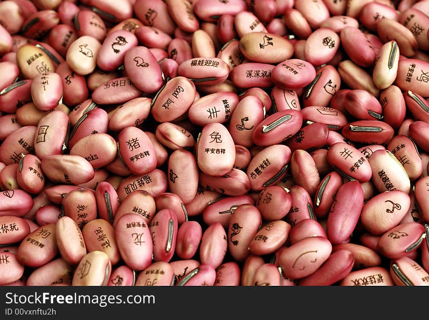 Bean seeds with lucky character and animal sign branded on it