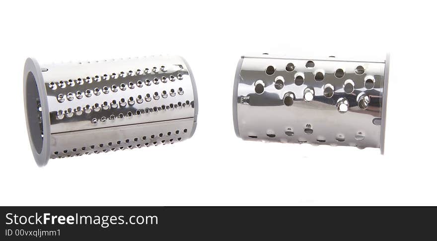 Two chrome attachments for a food processor on a white background. Two chrome attachments for a food processor on a white background