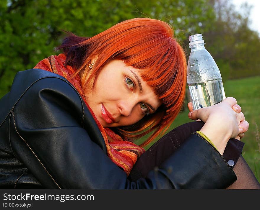 The beautiful young girl has a rest on the nature