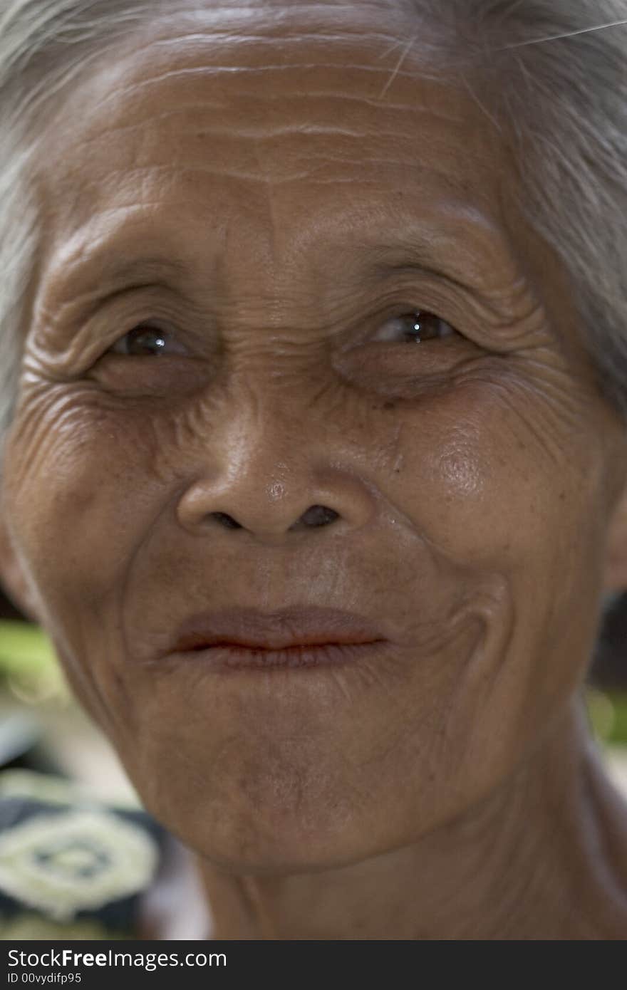 Portrait of an old Asian woman with gray hair