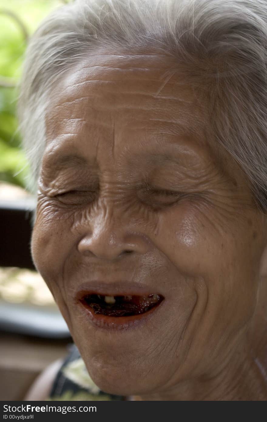 Portrait of an old Asian woman with gray hair