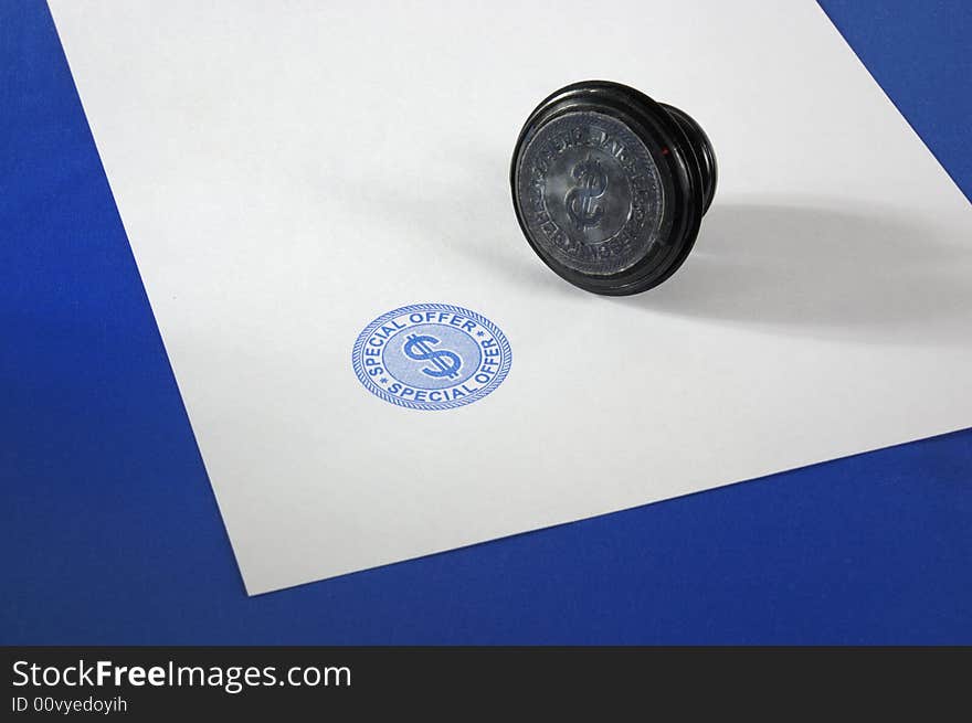 Stamp (special offer) on a blank page on a dark blue background