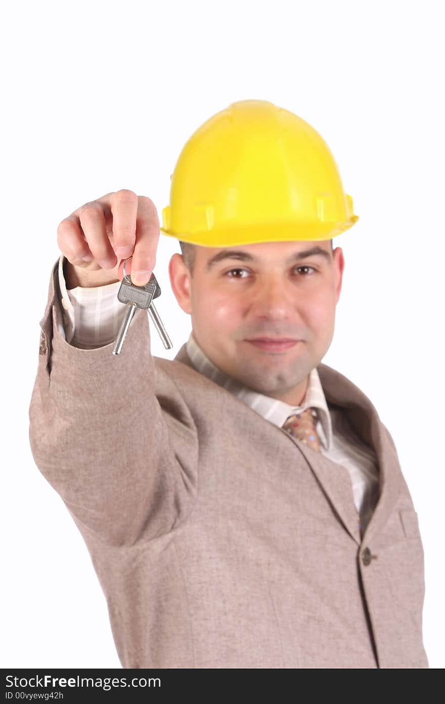 A businessman with keys on white background