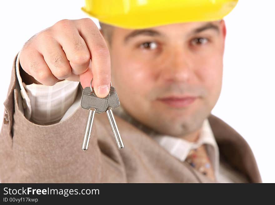 A businessman with keys on white background