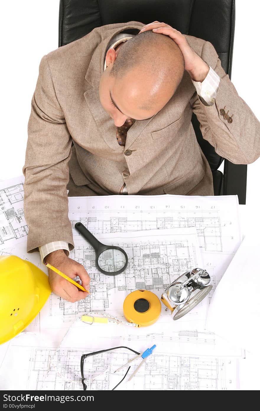 Businessman Thinking With Architectural Plans