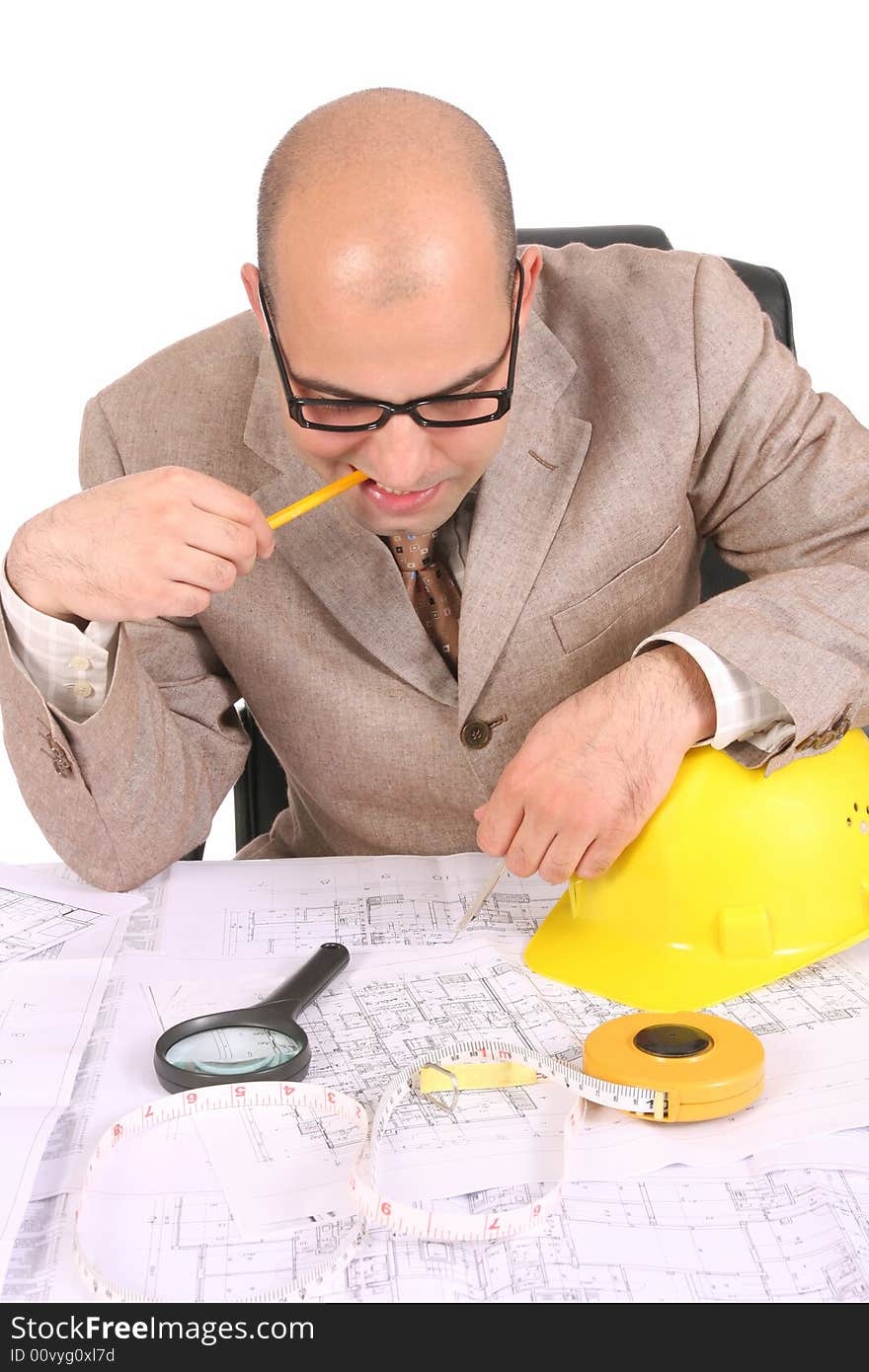 Businessman thinking with architectural plans on white background