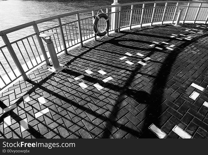 Railings and shadow by the bay