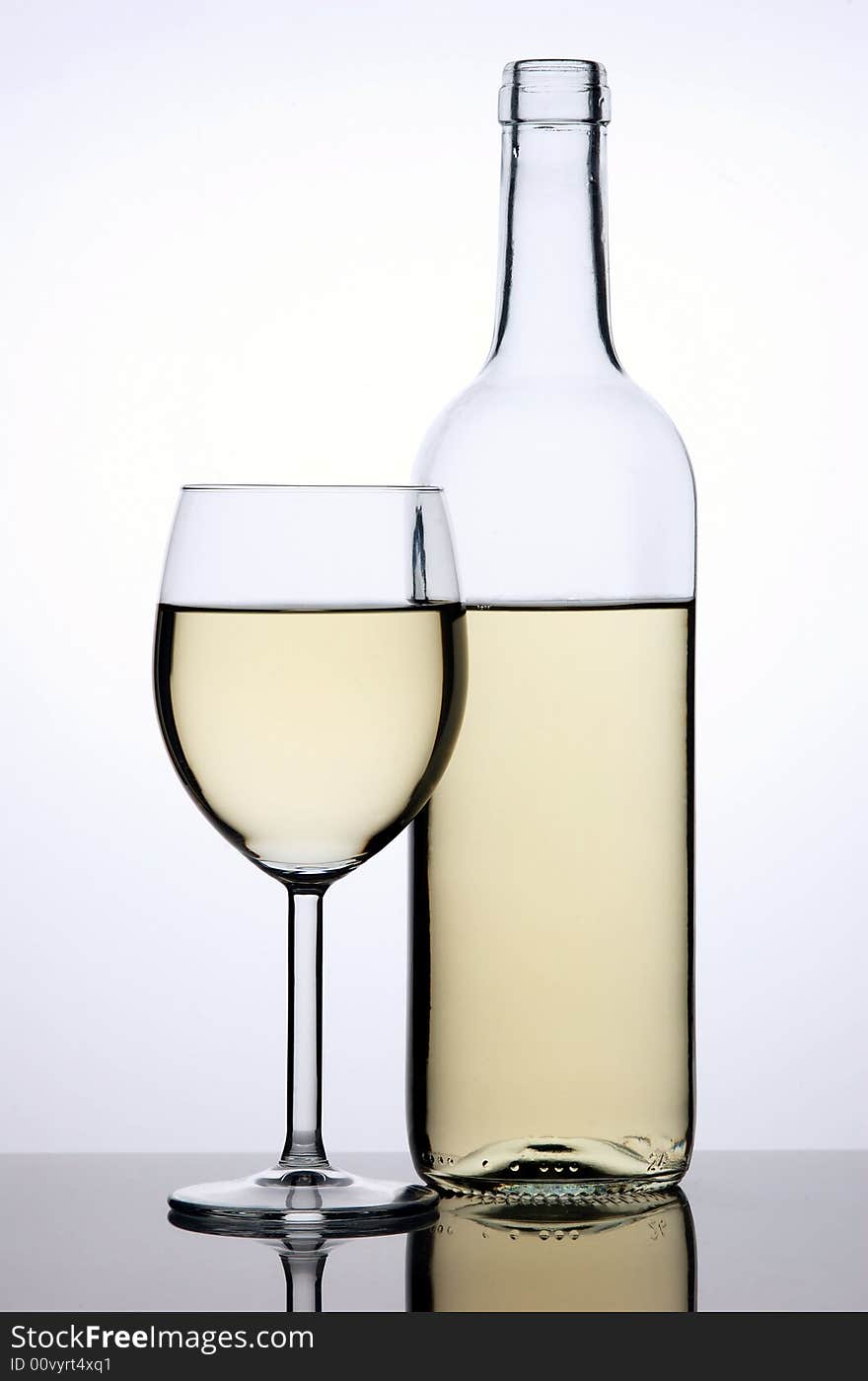 Bottle and glass of white wine