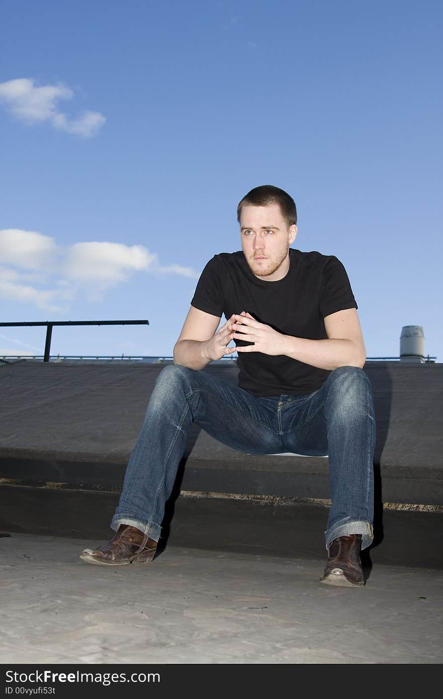 Portrait of a handsome young man on the roof. Portrait of a handsome young man on the roof