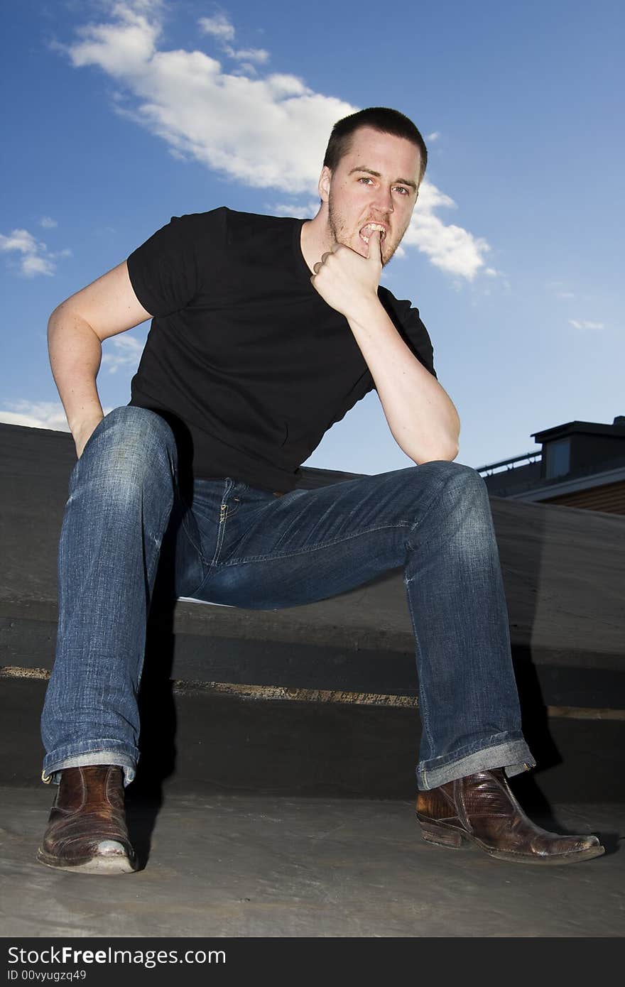 Portrait of a handsome young man on the roof. Portrait of a handsome young man on the roof