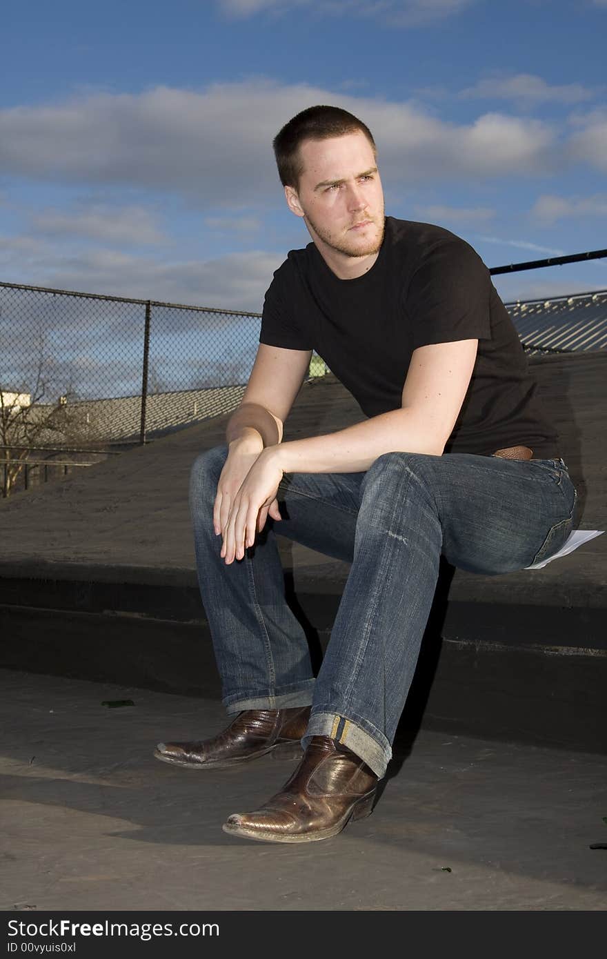 Portrait of a handsome young man on the roof. Portrait of a handsome young man on the roof