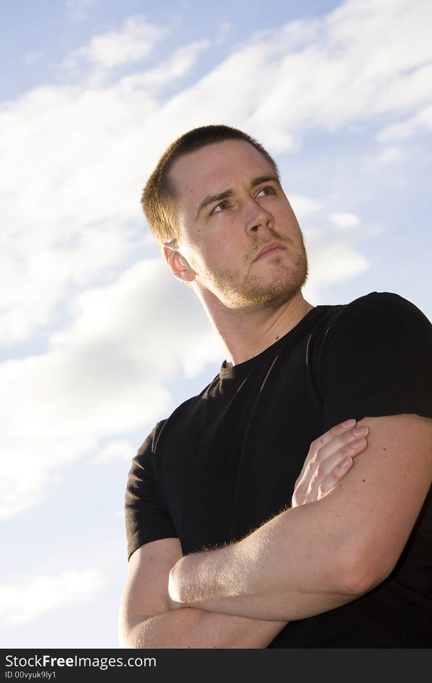 Portrait of a handsome young man on sky background. Portrait of a handsome young man on sky background