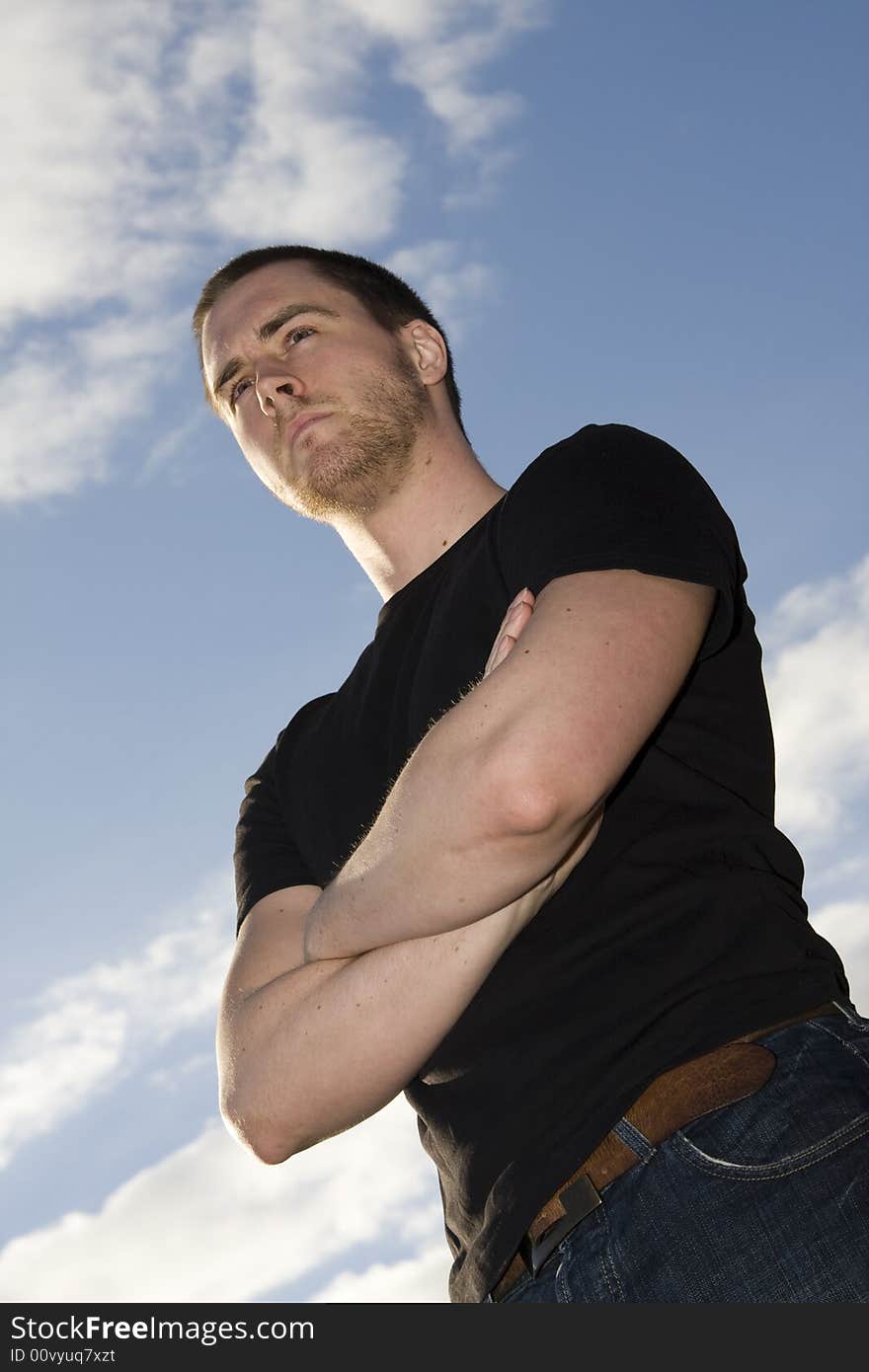 Portrait of a handsome young man on sky background. Portrait of a handsome young man on sky background