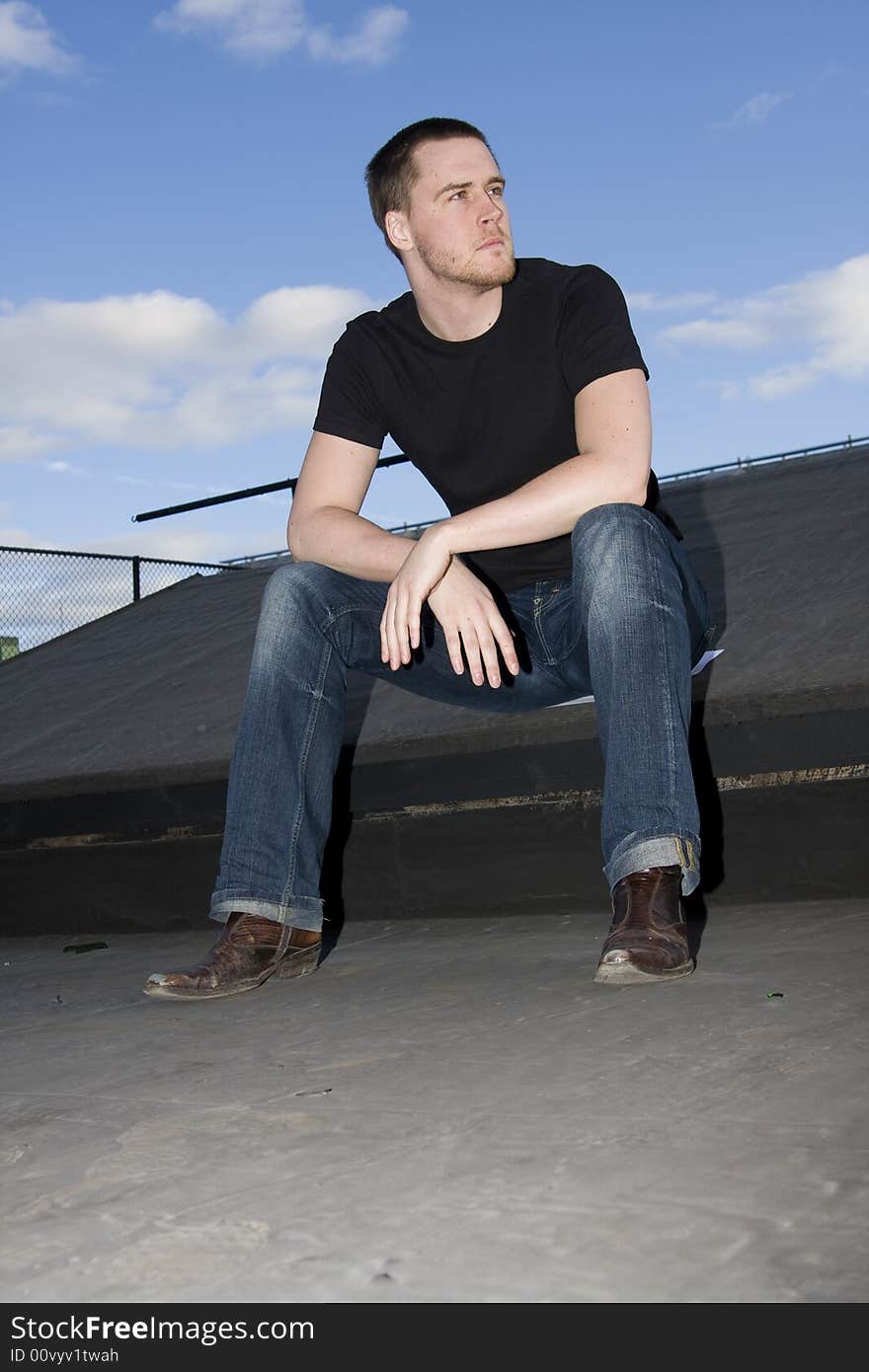 Portrait of a handsome young man on the roof. Portrait of a handsome young man on the roof