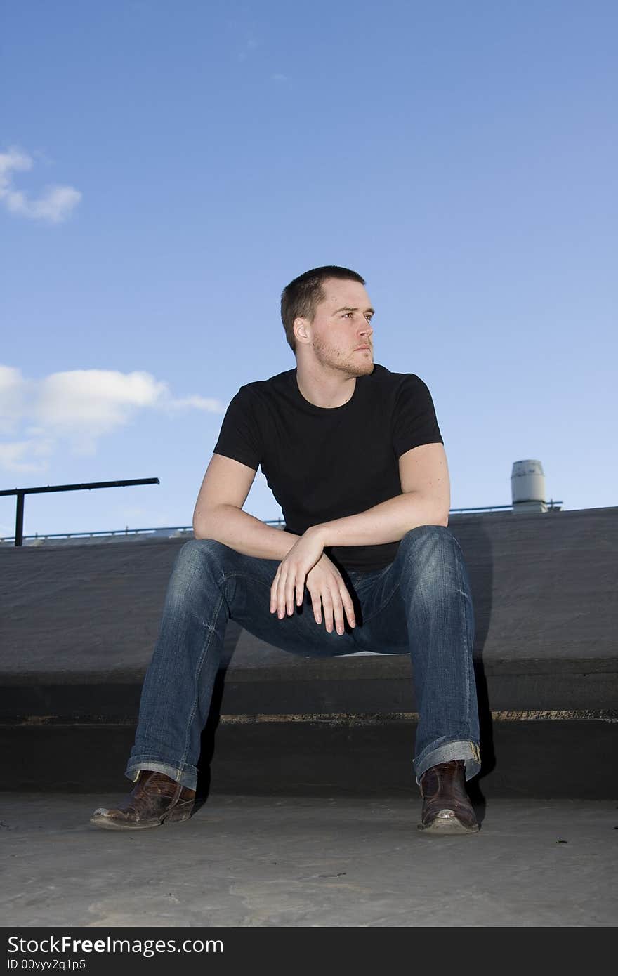 Portrait of a handsome young man on the roof. Portrait of a handsome young man on the roof