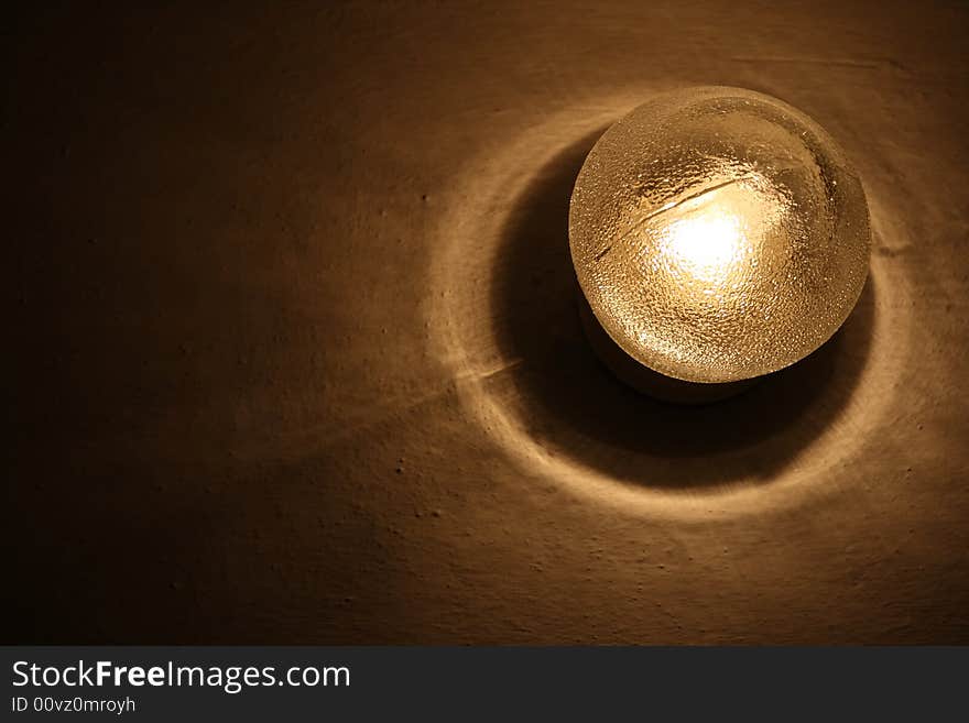 A photo of a lamp in a dark room.