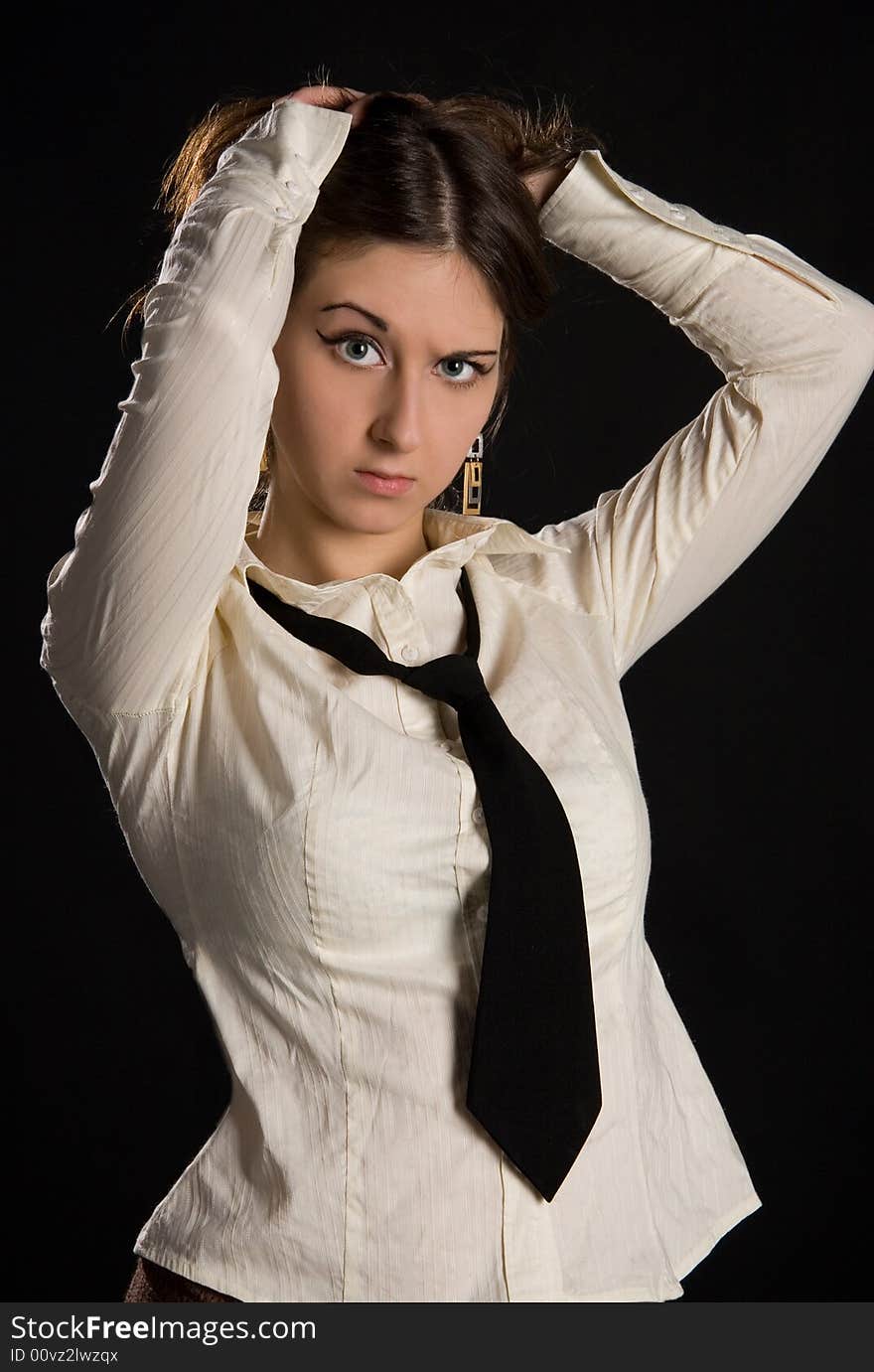 The brunette girl in a white shirt and black tie