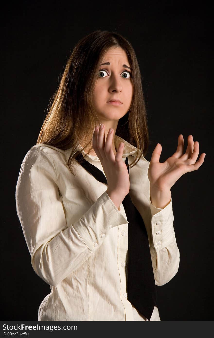 The brunette girl in a white shirt and black tie