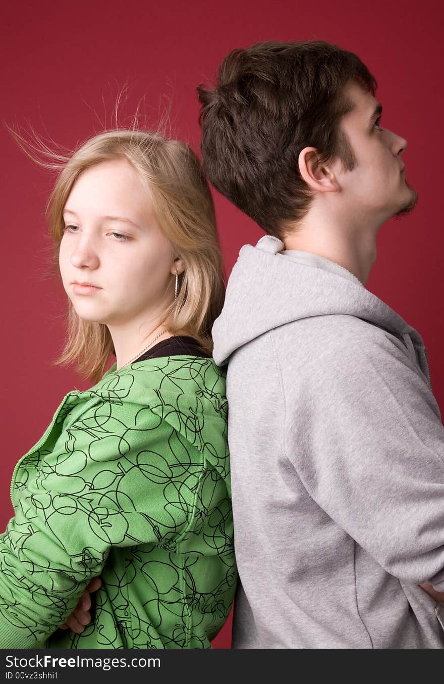 The young girl and the guy on a red background. The young girl and the guy on a red background.