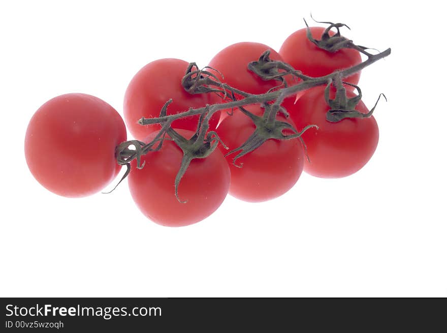 Bunch of cherry tomatoes on white