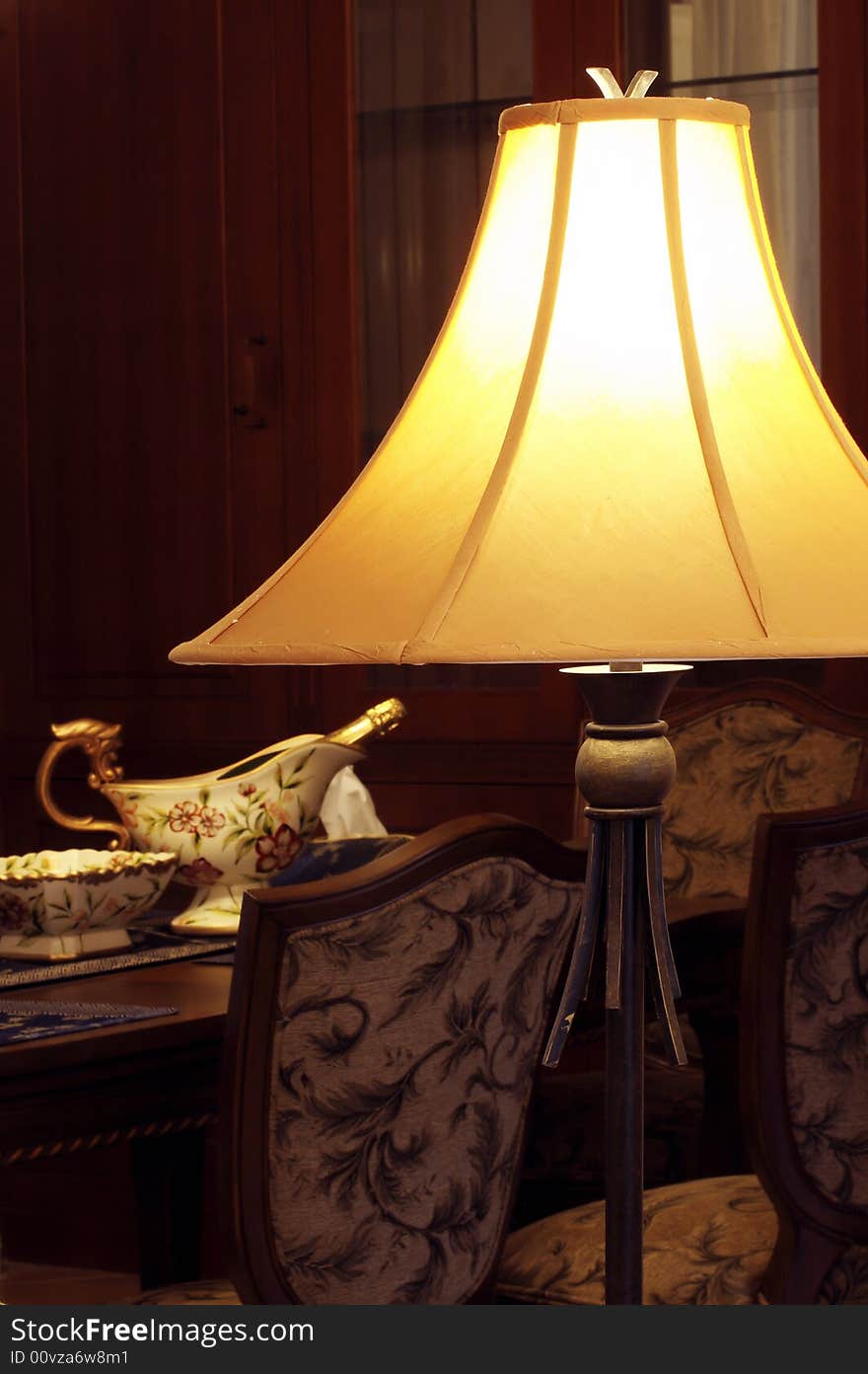 Antique floor lamp in the Western-style dining-room of the Chinese family.