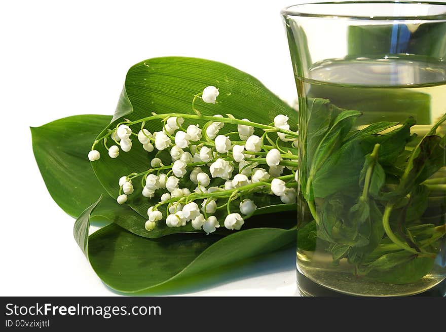 Bouquet of lilies of the valley and tea