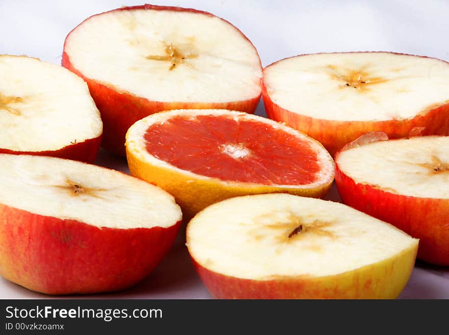 An orange and some apples