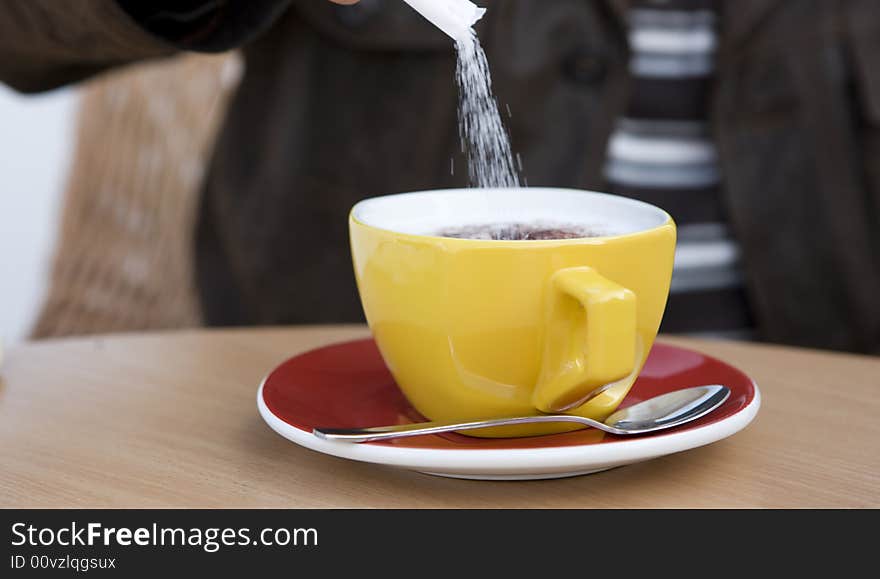 Yellow cup of coffee and sugar. Yellow cup of coffee and sugar