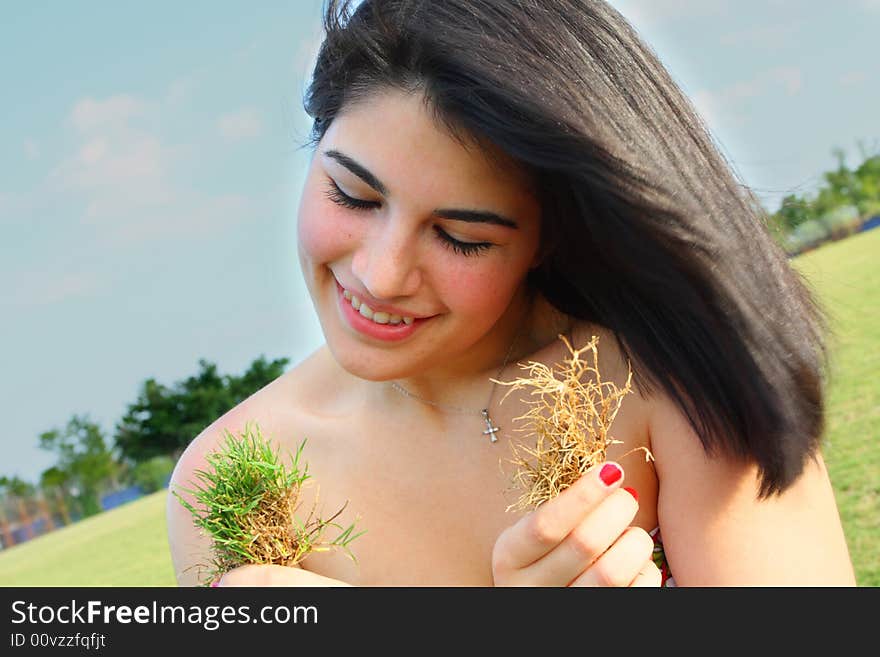 Woman Holding Grass Patches