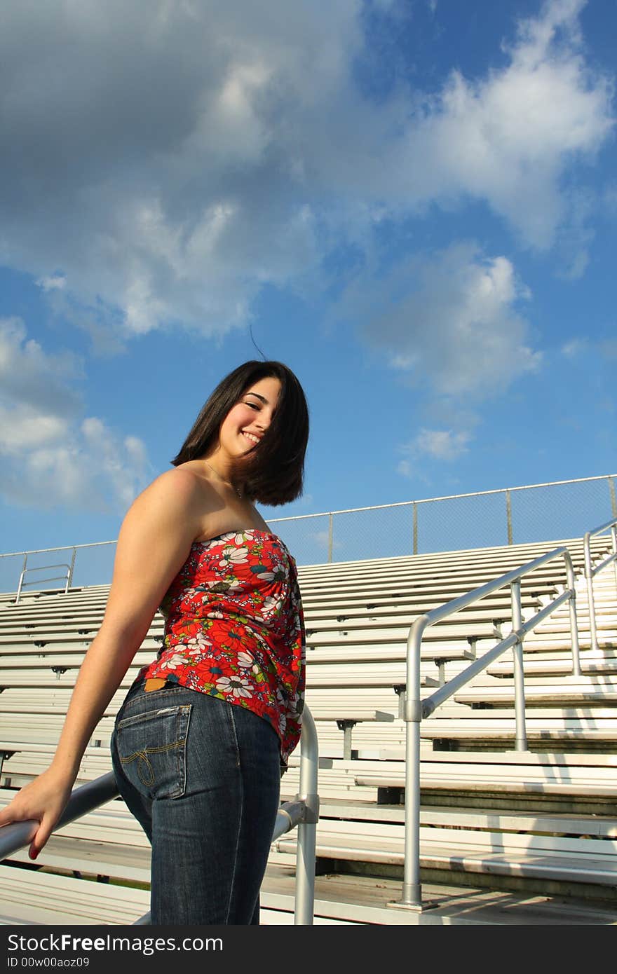 Woman walking on the bleachers. Woman walking on the bleachers