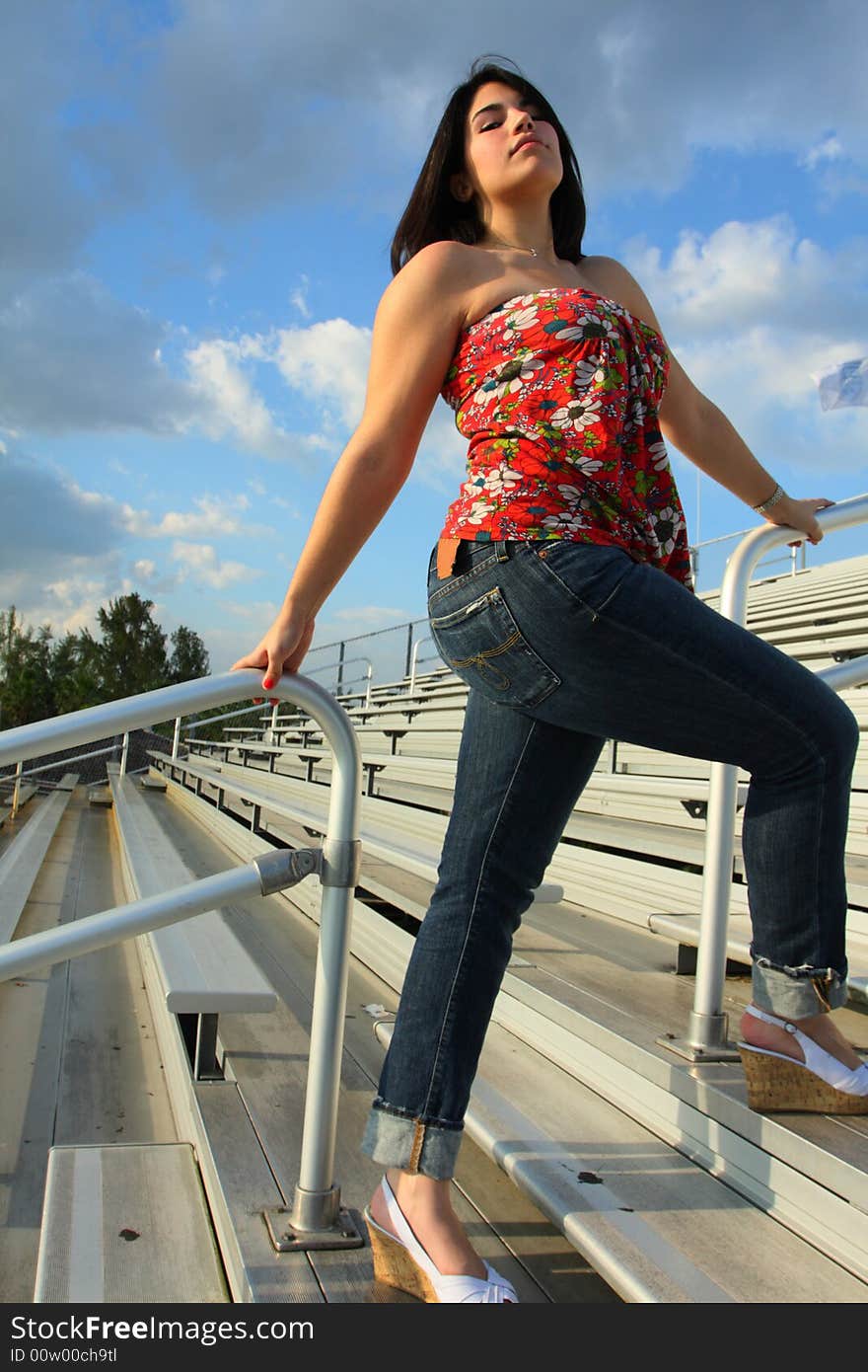 Woman on bleachers