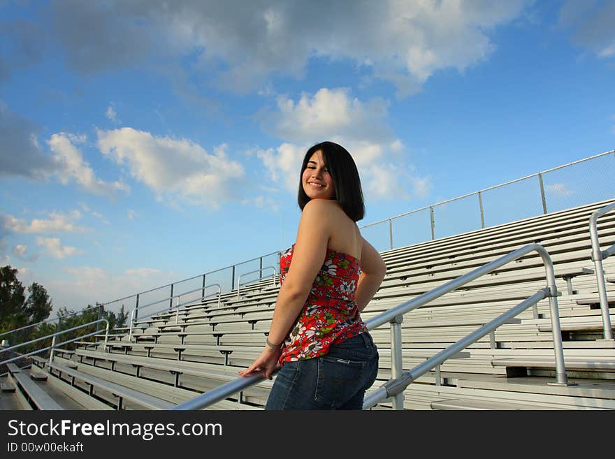 Woman on bleachers