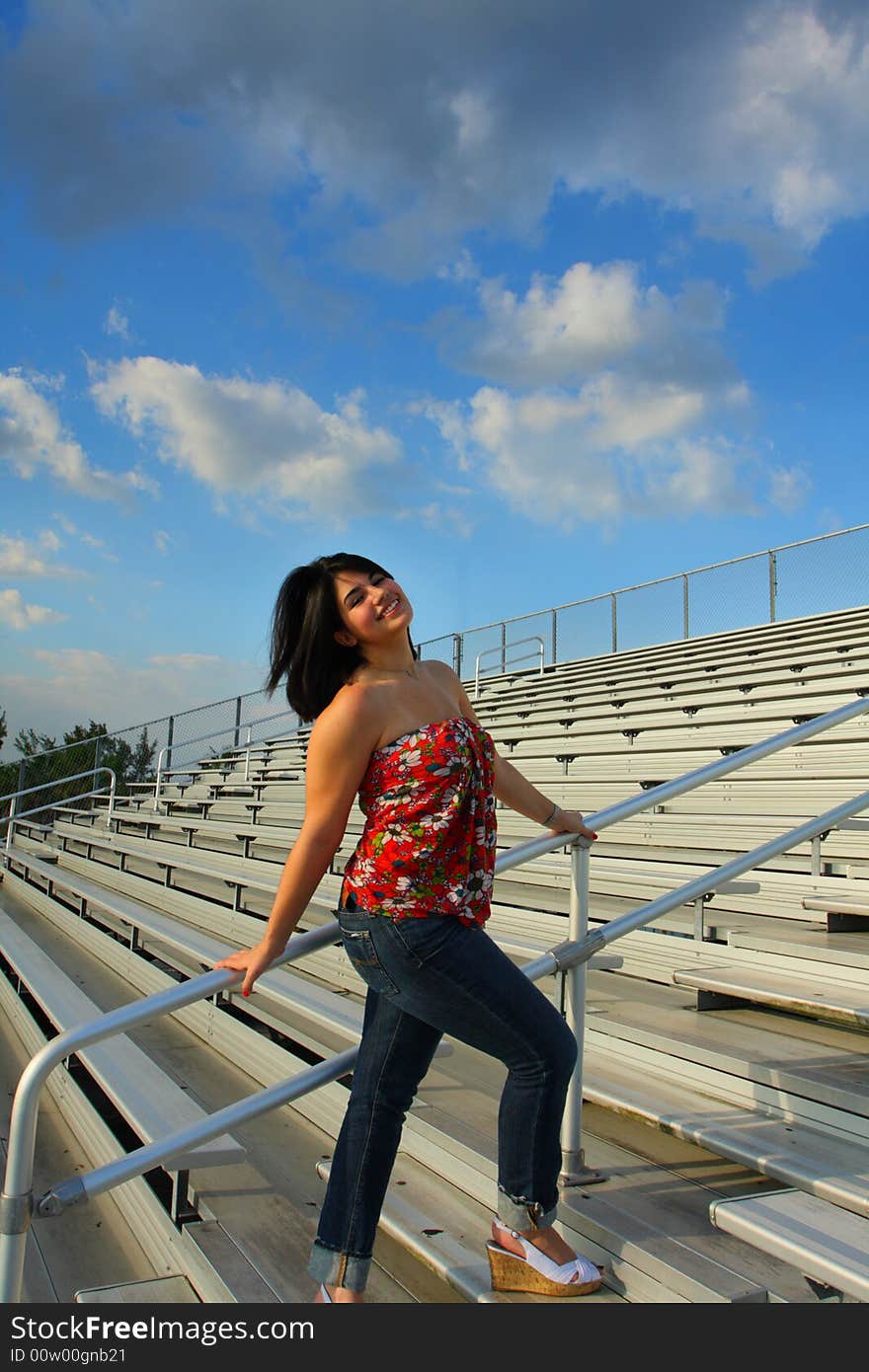 Woman walking on the bleachers. Woman walking on the bleachers