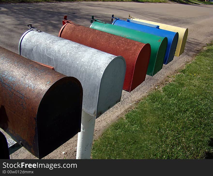 Colorfully painted residential mailboxes in small town in the rural Midwest. Colorfully painted residential mailboxes in small town in the rural Midwest