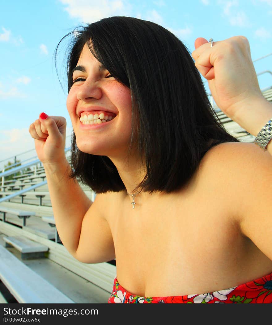 Woman cheering for her team to win the game