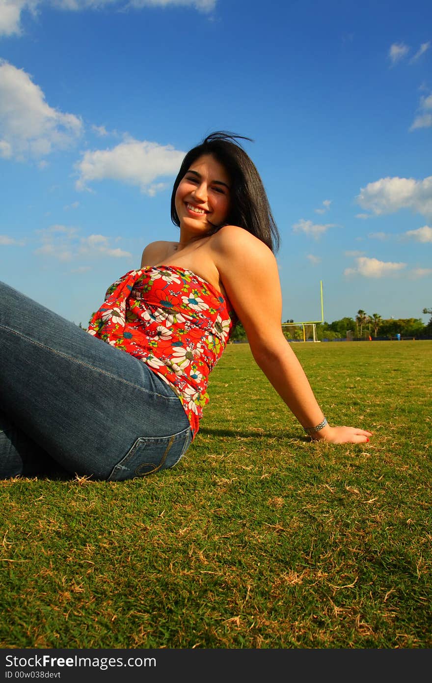 Woman sitting on grass