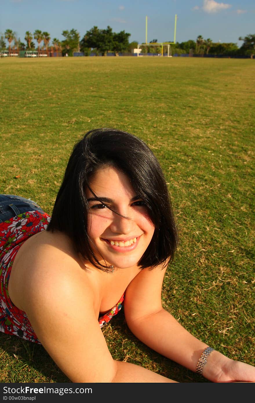 Girl Laying on a Field