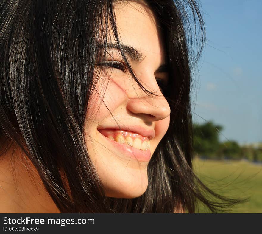 Headshot of a pretty young woman smiling. Headshot of a pretty young woman smiling.