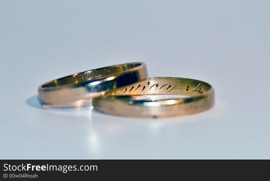 Close up photo of 2 wedding rings isolated on a blank back ground