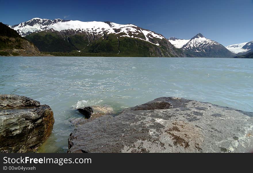 Rocks, lake and portage glacier