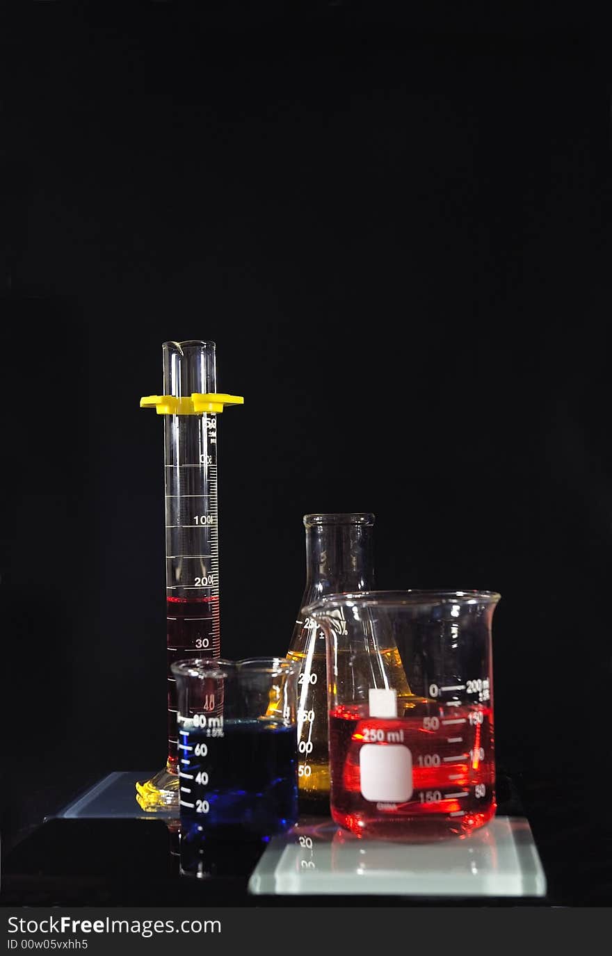 Several beakers with colored chemicals. Several beakers with colored chemicals