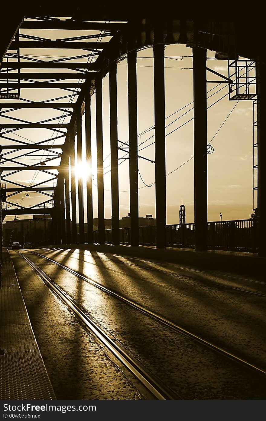 An old bridge  construction silhouette on sunset. An old bridge  construction silhouette on sunset.