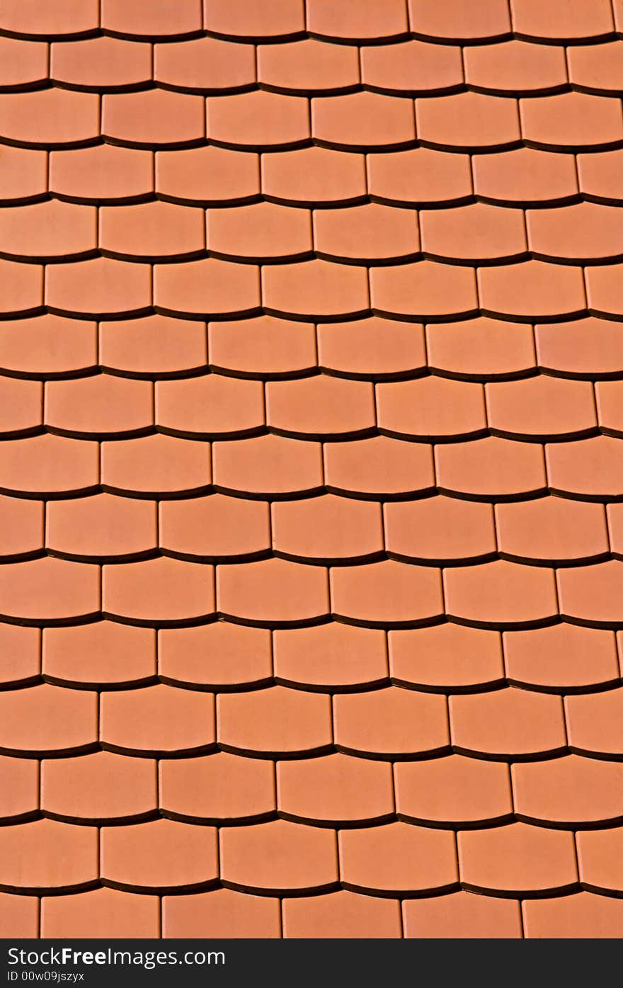 Traditional orange tiles of a newly built house. Traditional orange tiles of a newly built house